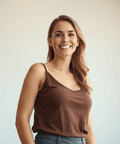 Smiling woman in a brown tank top, representing confidence and health benefits of using Weight-loss Accelerator Extract.